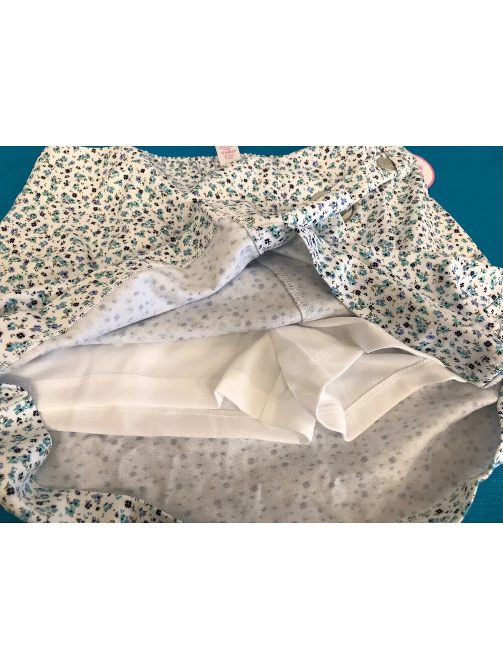 Justice Girls Skort. White With Blue & Green Flowers. White Shorts. Size 10. NWT